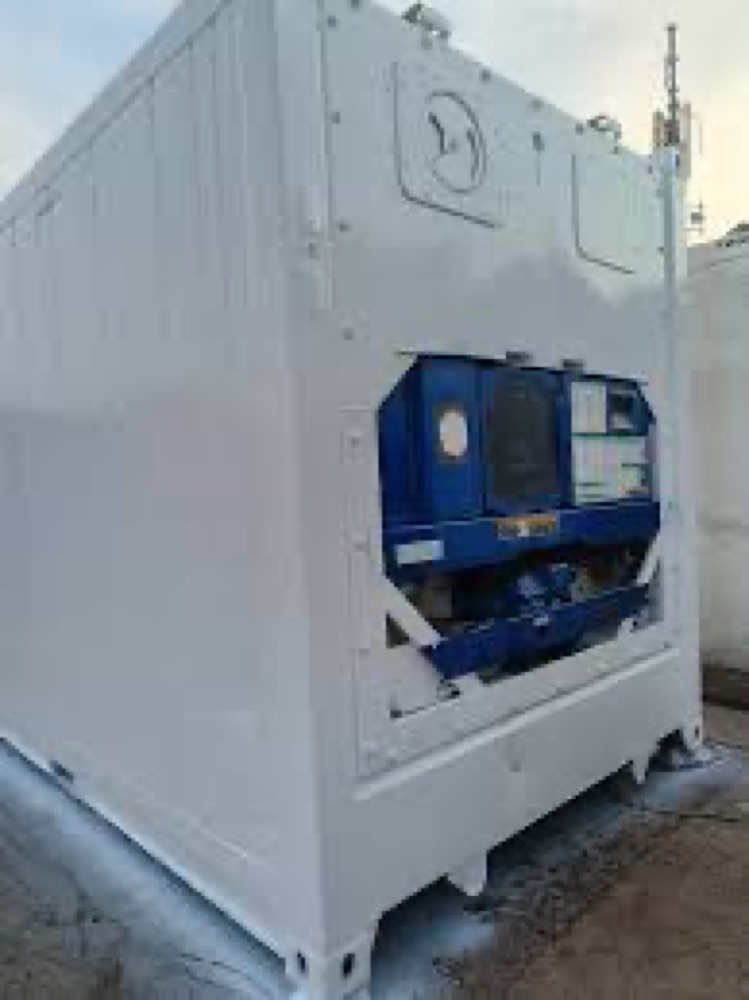 Mobile refrigerated container unit awaiting repair